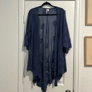 a blue see through cardigan